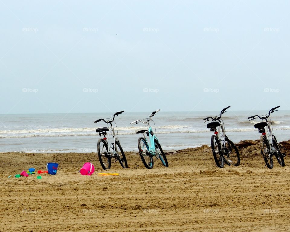 I want to ride my bicycle!. Bikes parked on a beach 