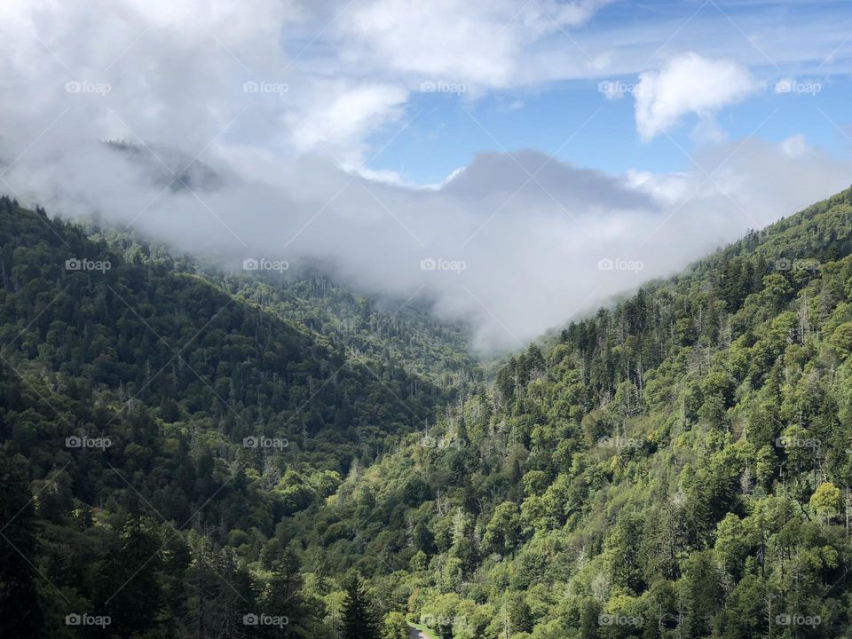 Big Beautiful Sky with huge fluffy Clouds hanging over Great Smoky Mountain Range
