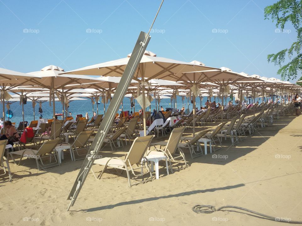 White Sunbeds on the beach