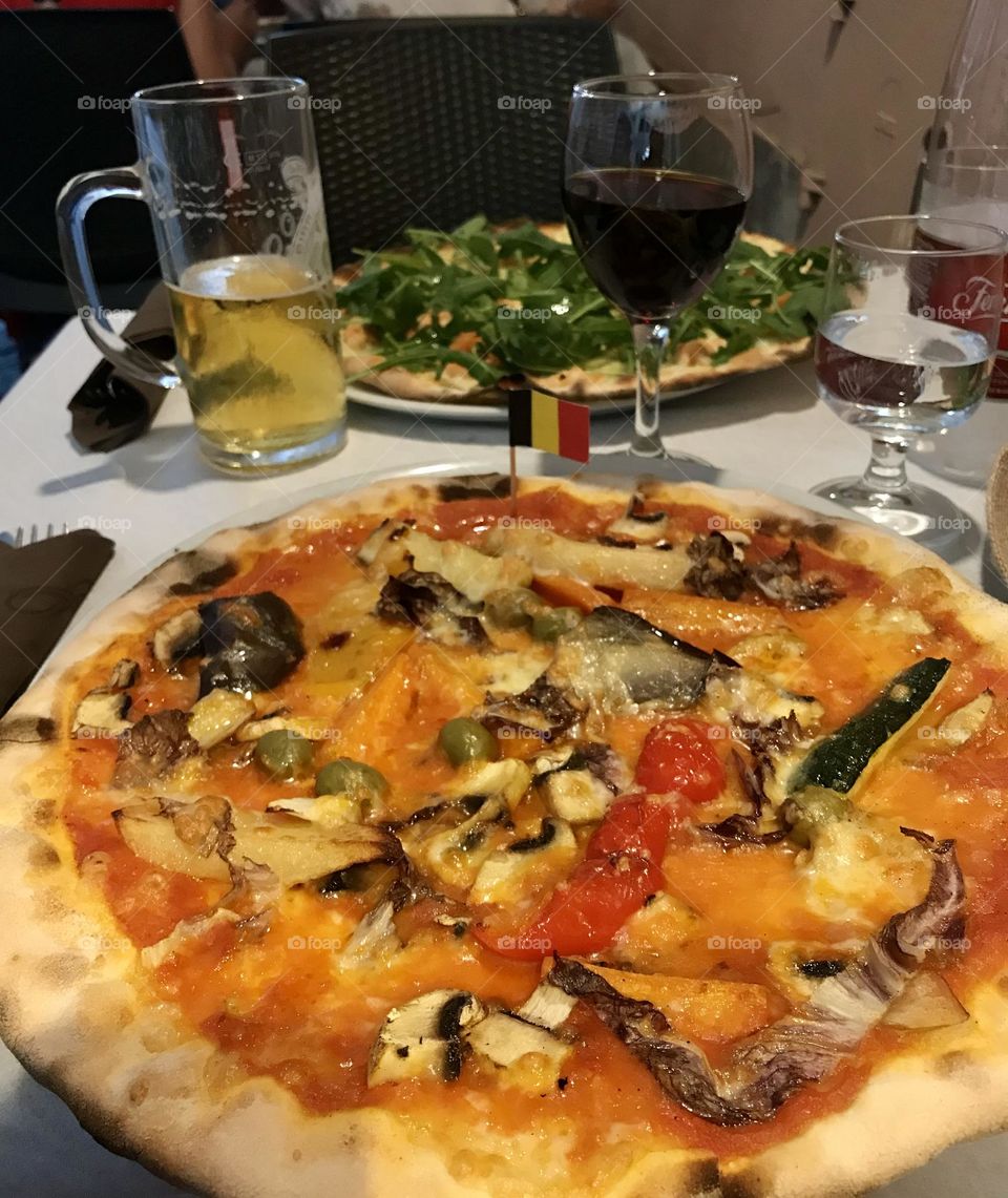 Vegetarian pizza with eggplant, mushrooms, red peppers and olives.