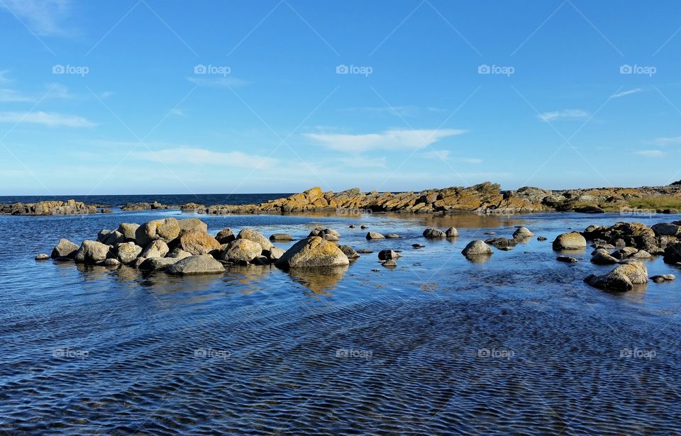 shining little rocks in the sea