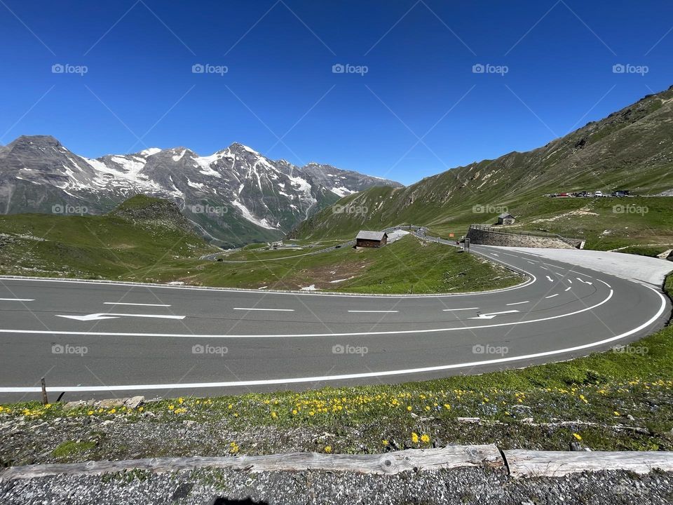 Road trip on Großglockner high alpine road  in the alps of Austria on a sunny summer day, view of mountains and road