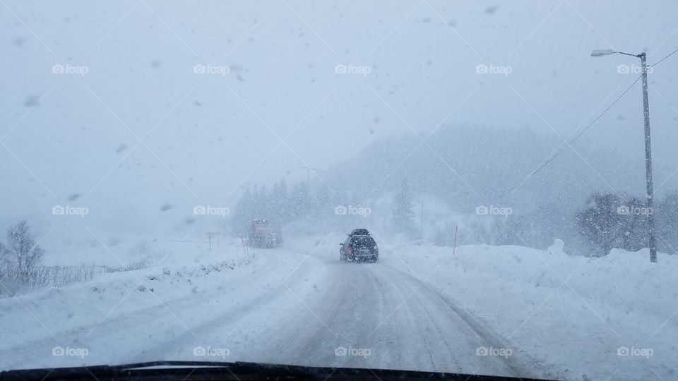 Driving in the snow blizzard