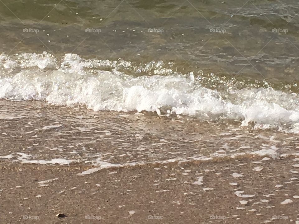 Waves crashing on the beach.