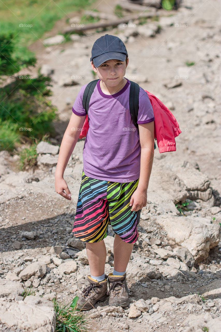 Boy on mountain trail