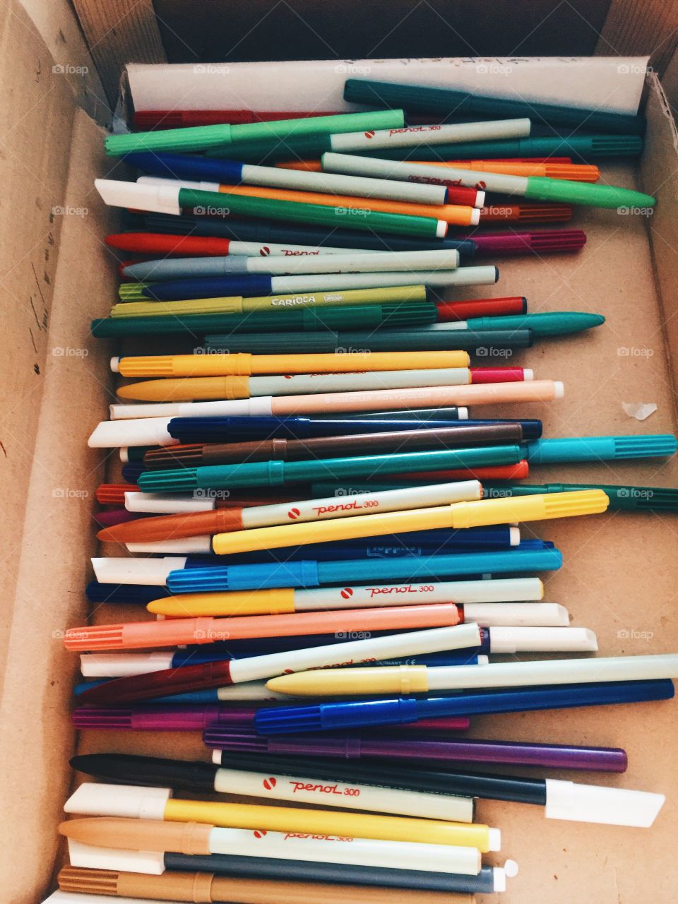 A bunch of colourful pens