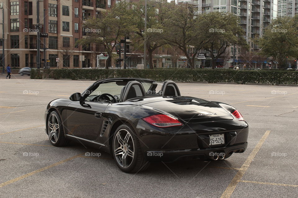 Black 2010 porsche boxster s 987.2 in city, unsaturated