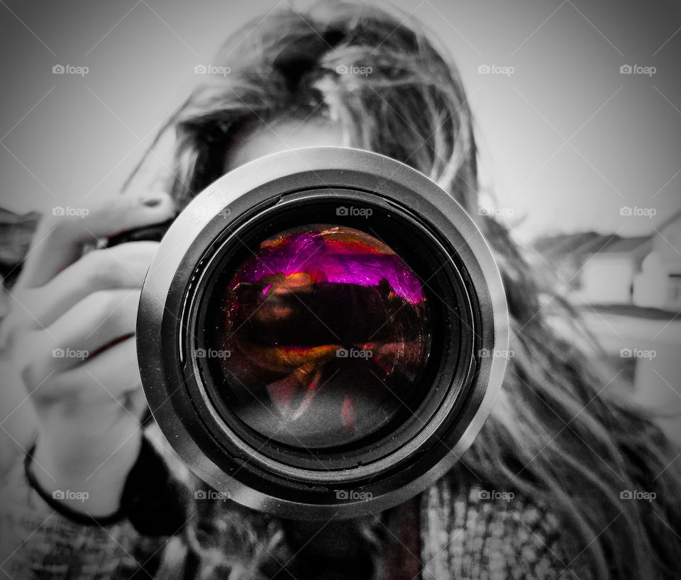 Woman taking photo with digital camera