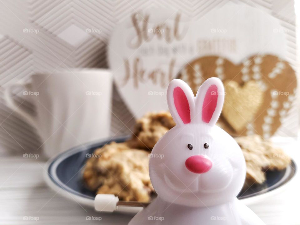 The Year of the Rabbit. A symbolic representation with a wind up Rabbit.   We often wind up and run non stop, but in the year of the Rabbit it is time to slow down, reflect, have hope and peace. Maybe stop to enjoy some cookies and tea.