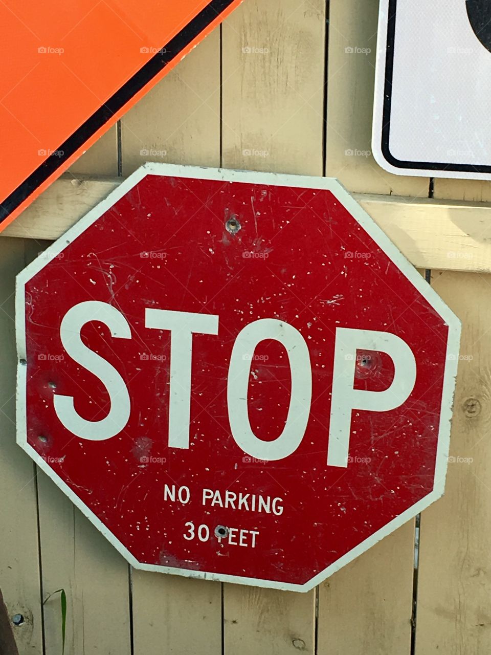 Red stop sign on fence