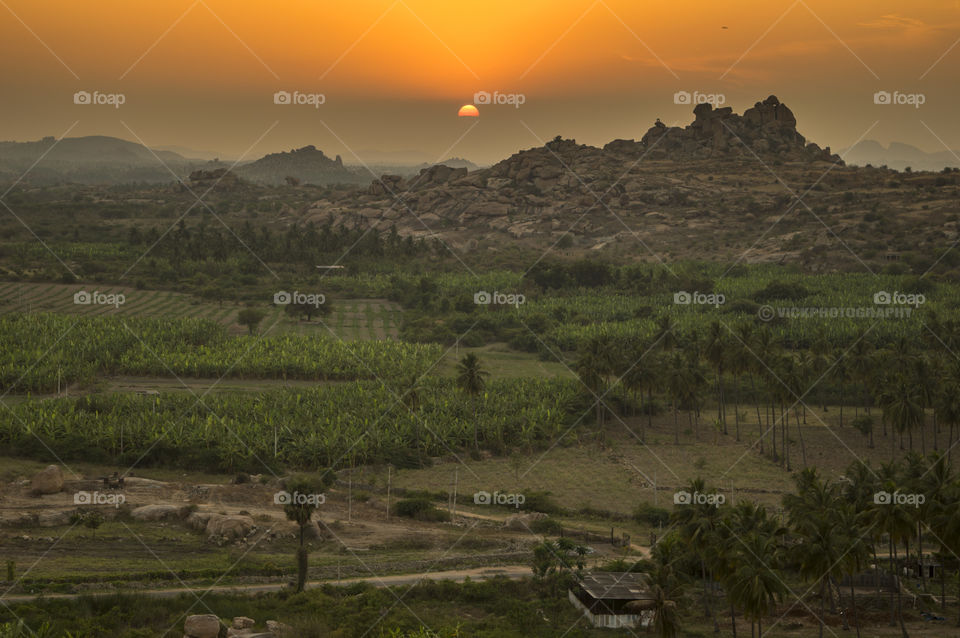 Exquisite View standing atop a Stone/Boulder !!
Why need a drone or building or climb hill, when one can experience splendid view from this place while being at ease with tranquillity and peace added !!?
Location: Hampi,Karnataka,India.
Camera: Nikon D3200