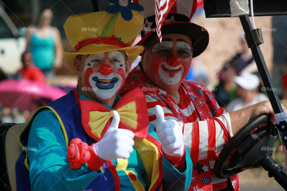 Clowns in a car in a parade. July 4th parade Edmond, OK