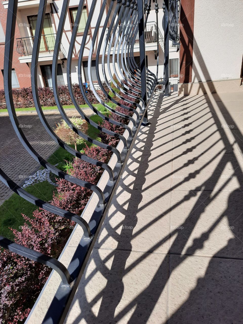 metal railing on the balcony and its shadows