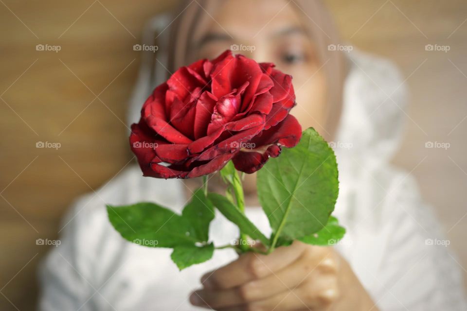 holding flower