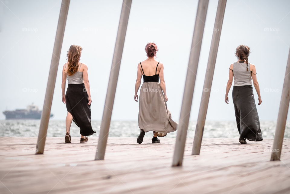 Three Women Dancers On The Dock
