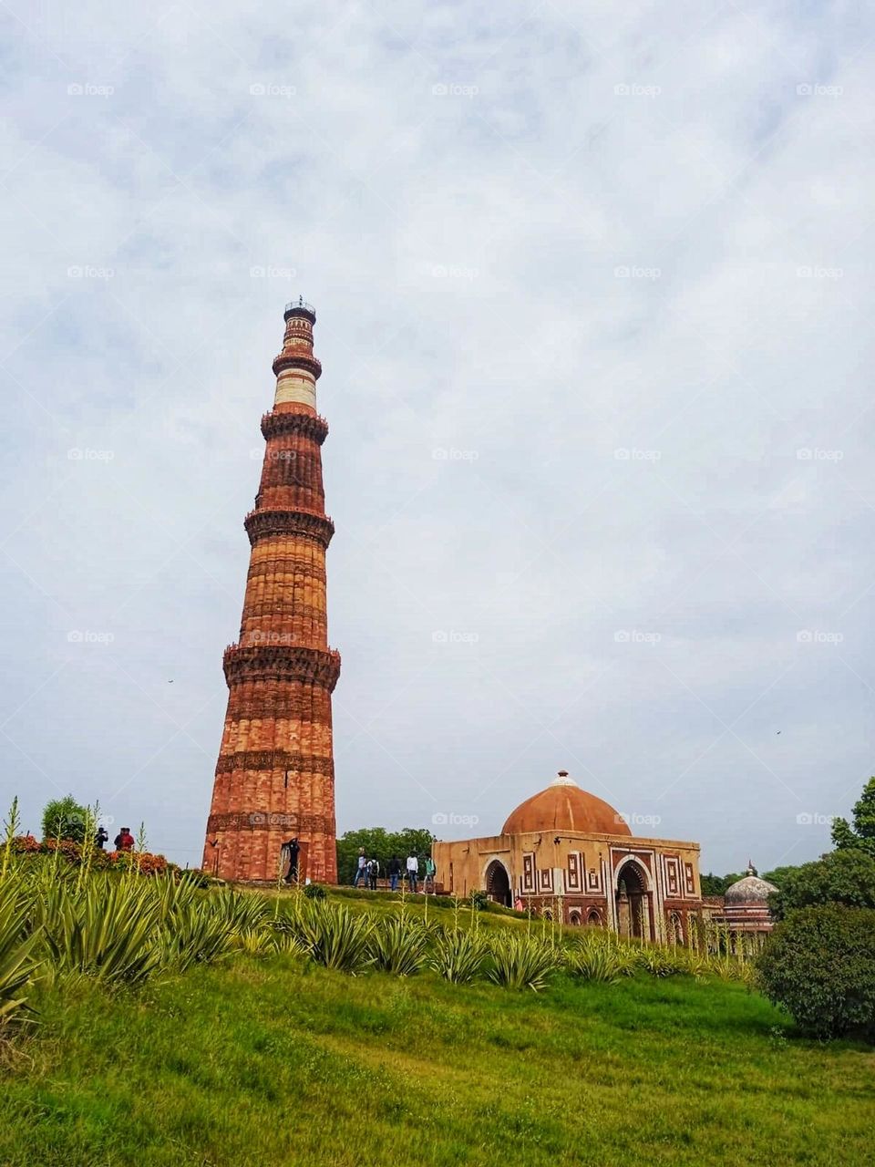 That tower on the hill looks like it's standing tall and proud! It's like the king of the hill, overseeing its kingdom below. What a majestic sight! π°π³