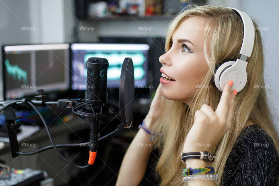 girl singing into a microphone