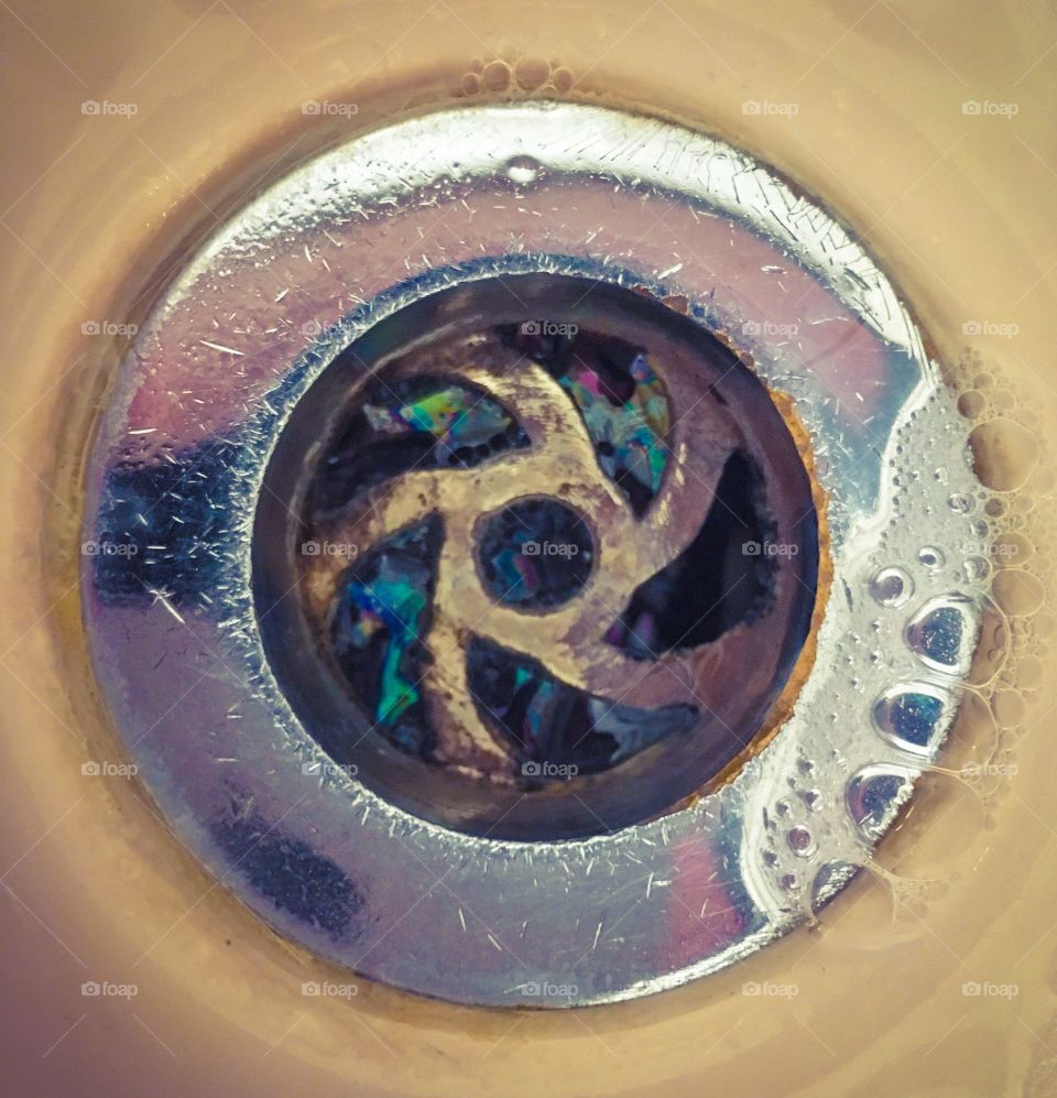 Suds going down plug hole. 