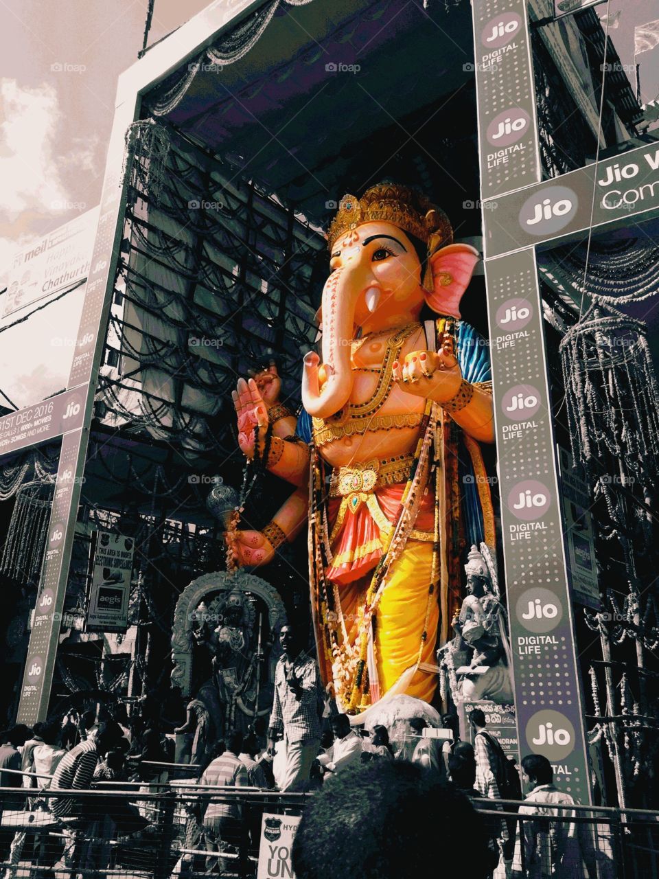 Color idol, greyscale surrounding, Ganesh festival. Hyderabad, India