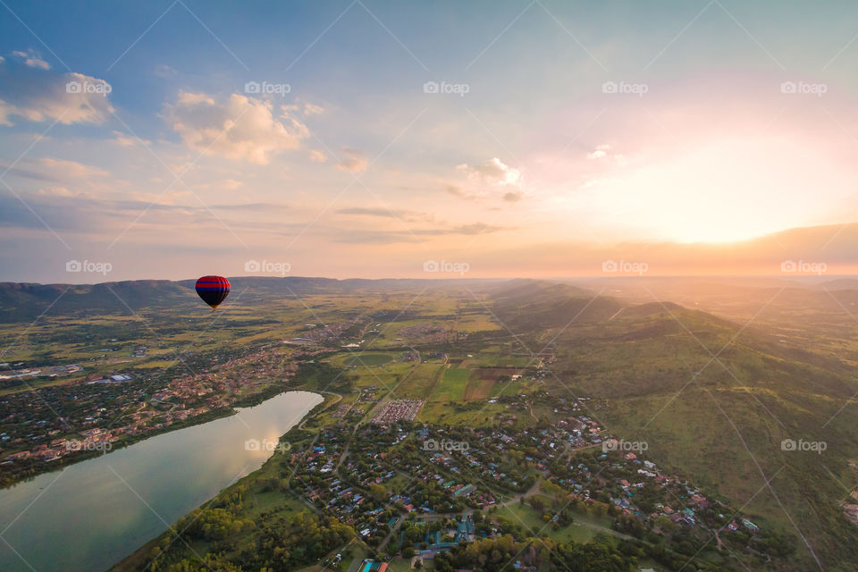 2019 landscapes - a beautiful scenic photo of a balloon trip at sunrise with a river and town in the distance