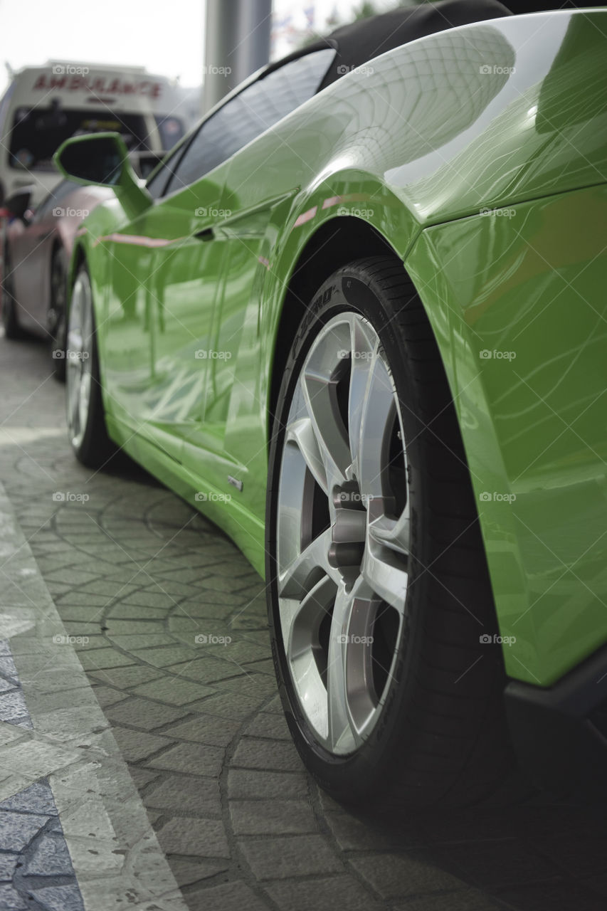 wheel close up of green Lamborghini Gallardo squadra corse special edition coupe
