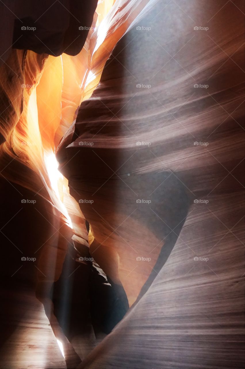 rays of light in a canyon are like as a courtains