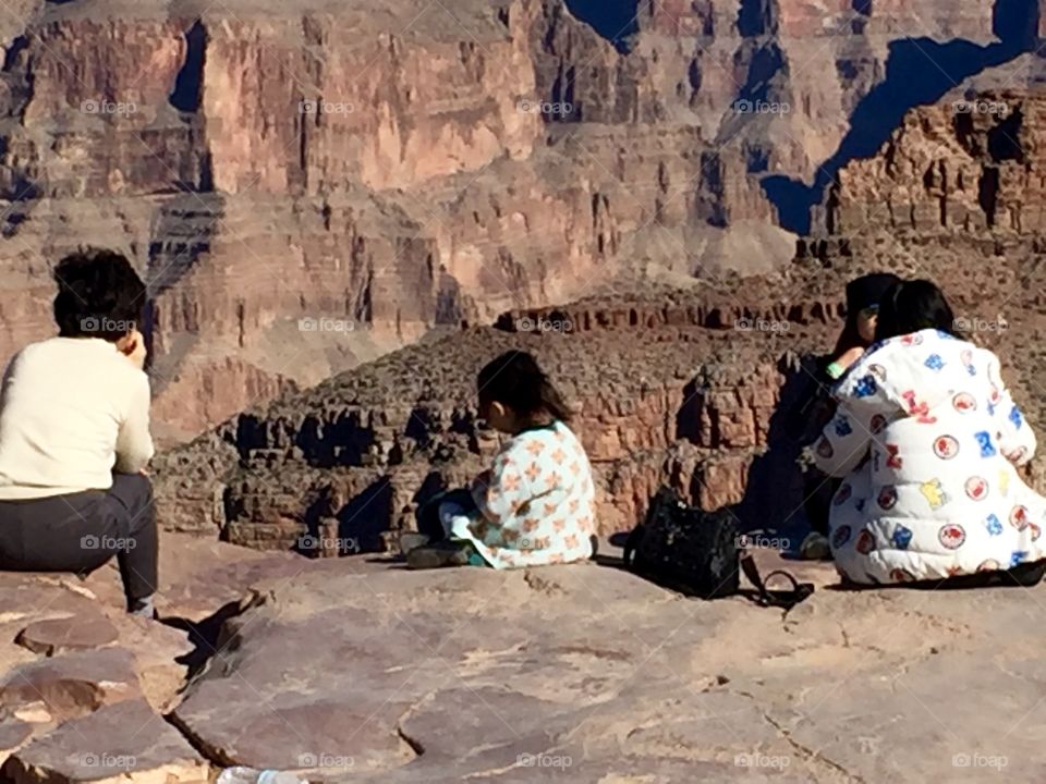 Two women and a child on the edge of the Grand Canyon. This made me nervous 