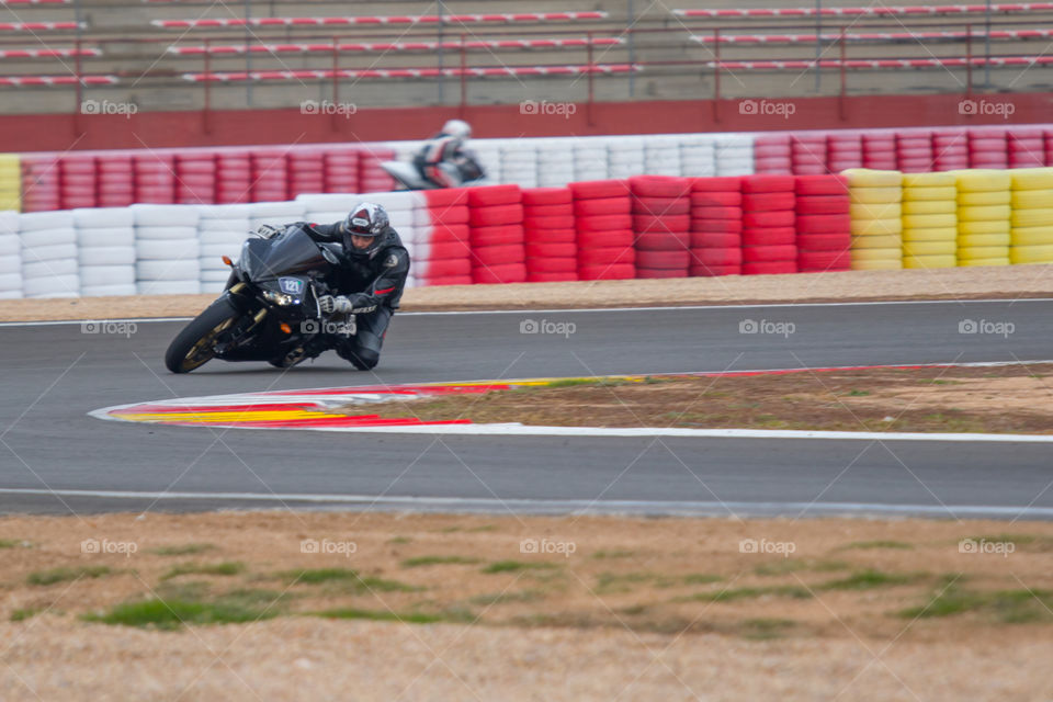 Riding motorbike on circuit 