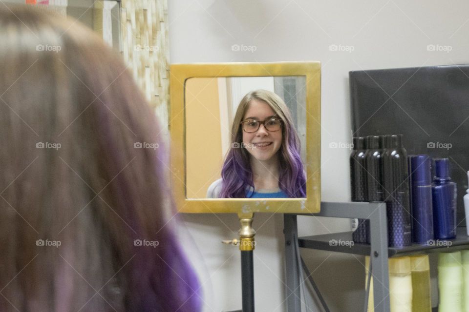 Girl with dyed purple hair at the salon
