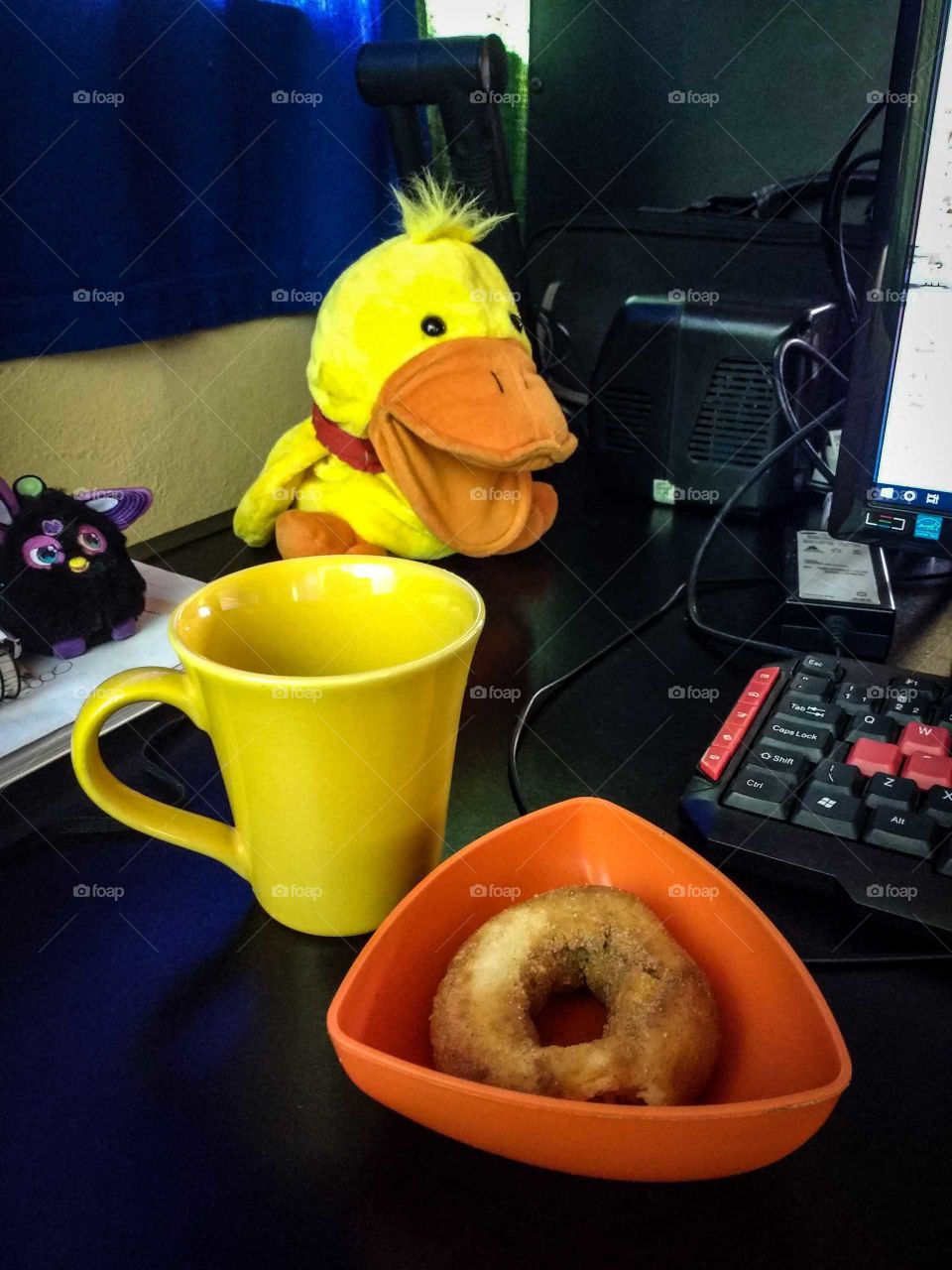 coffee with donut at work toys make up the table