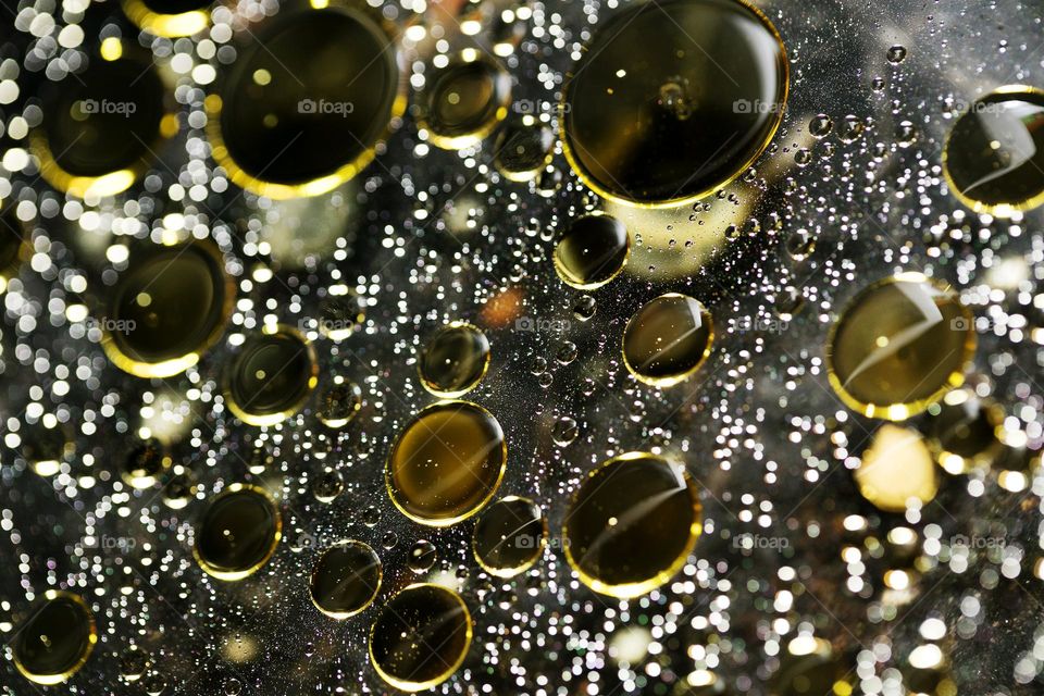 Oil golden bubbles close up background amazing droplets with colours trippy psychedelic minimalist art attack making wonderful view