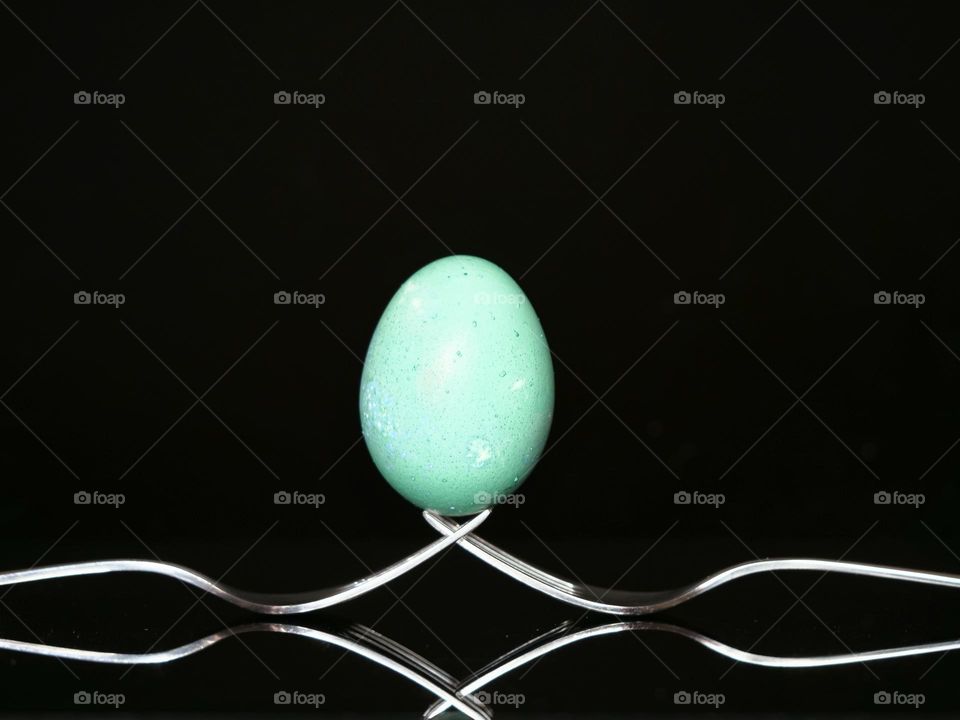 Green egg on forks