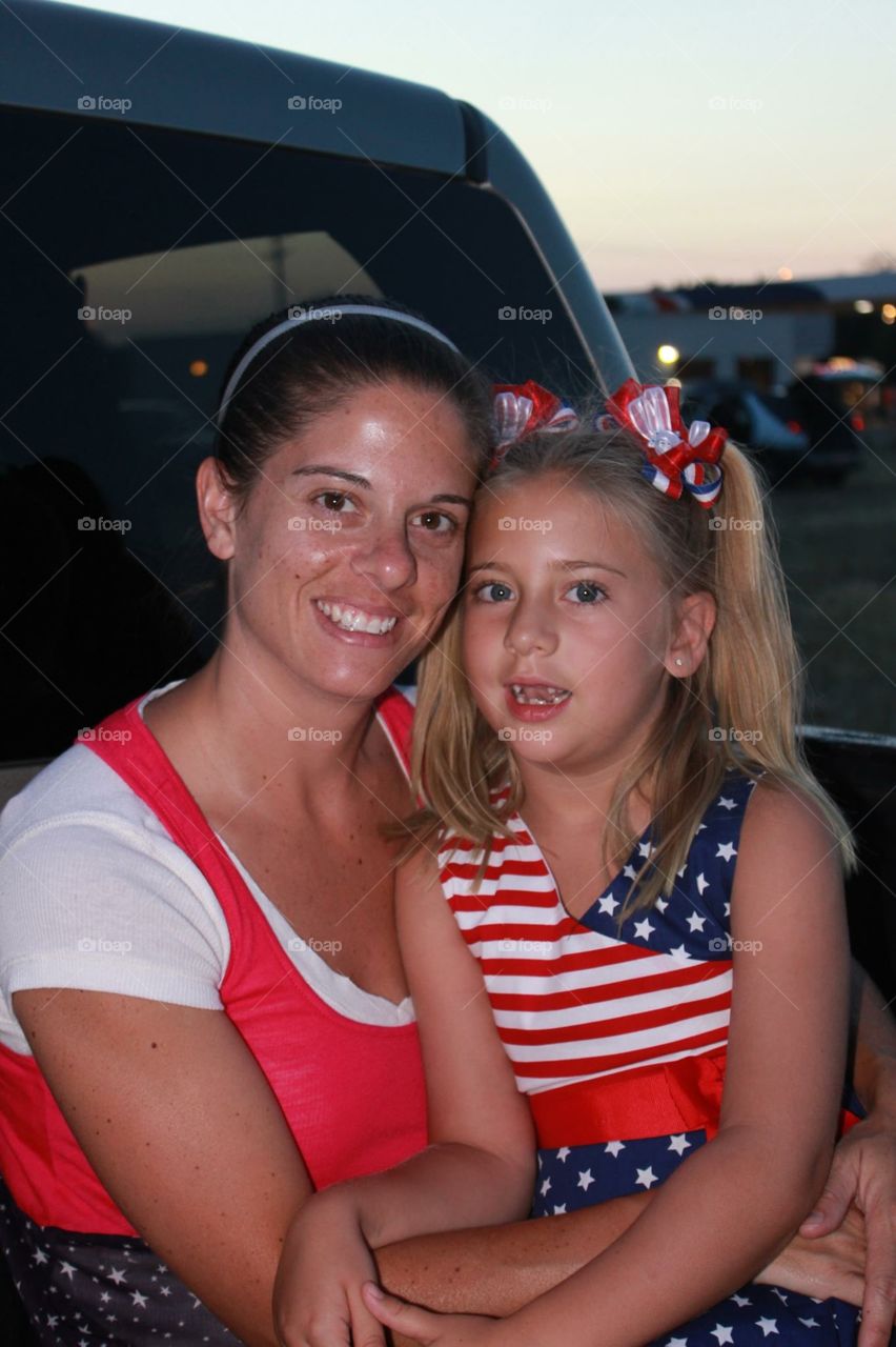 Happy fourth. Mom and daughter getting ready to watch 4th of July fireworks