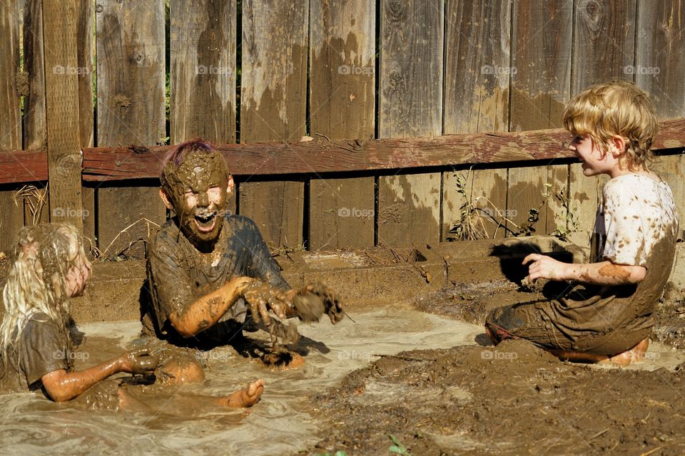 Boys Playing In Mud