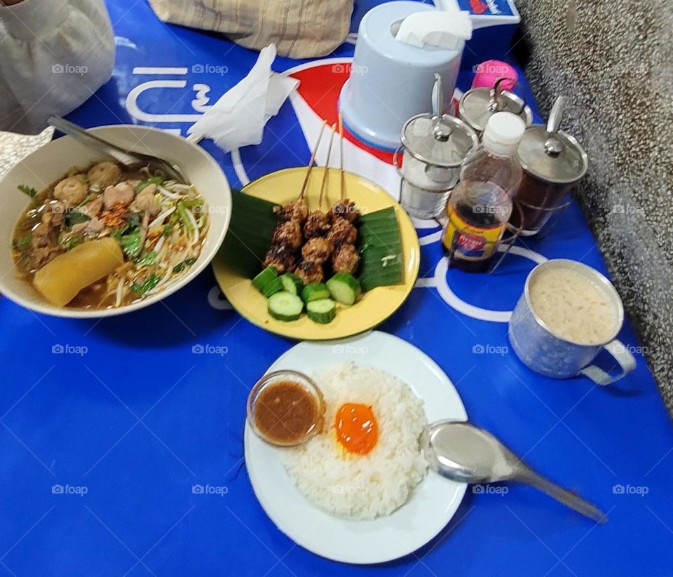 Toasted meatballs
,boat noodles 
, Pickled egg yolk with fish sauce and rice