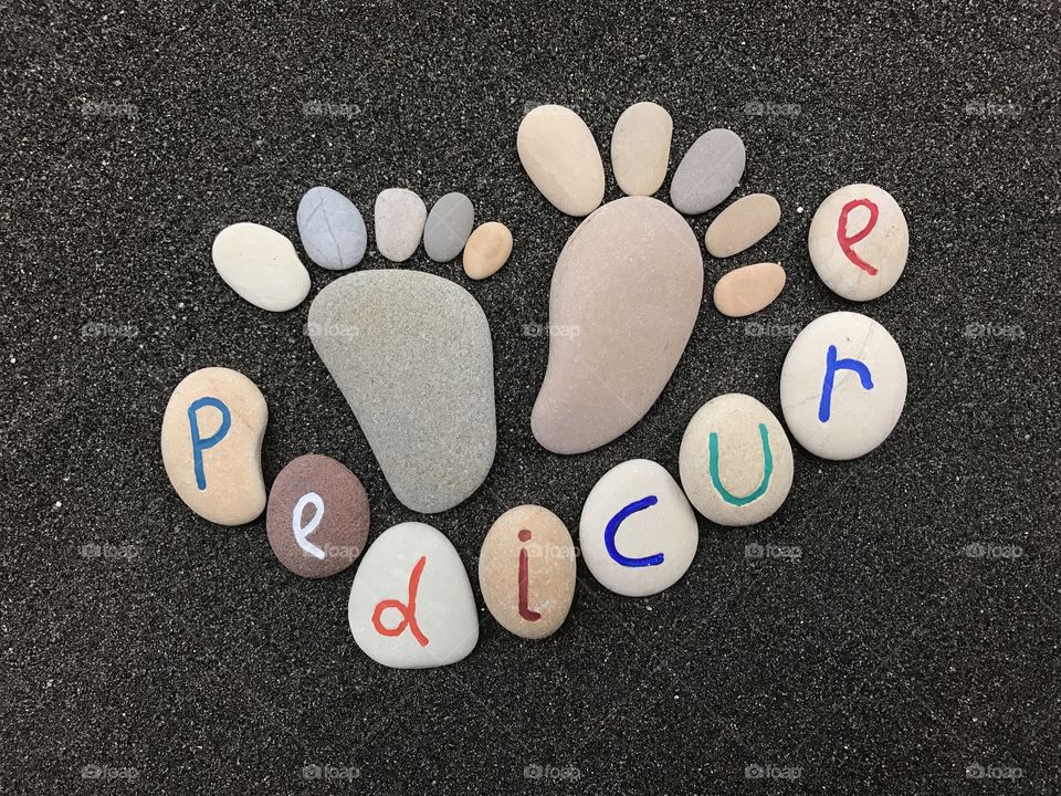Pedicure concept with stones and pebbles composition 