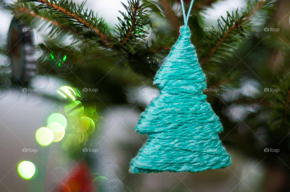 Blue knight Christmas tree in focus with blurred background 