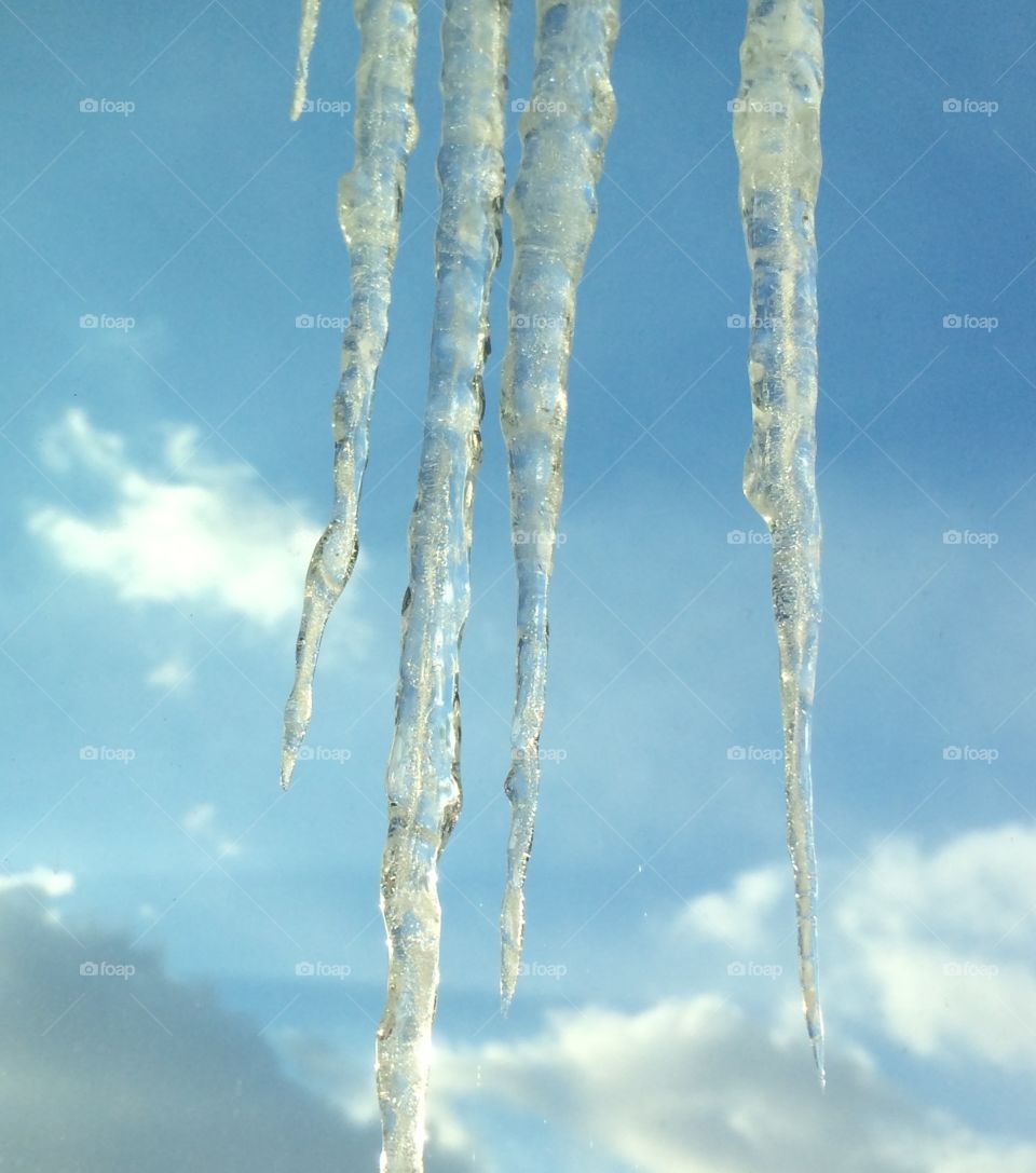 Icicles. Winter roof ledge sky ice drip