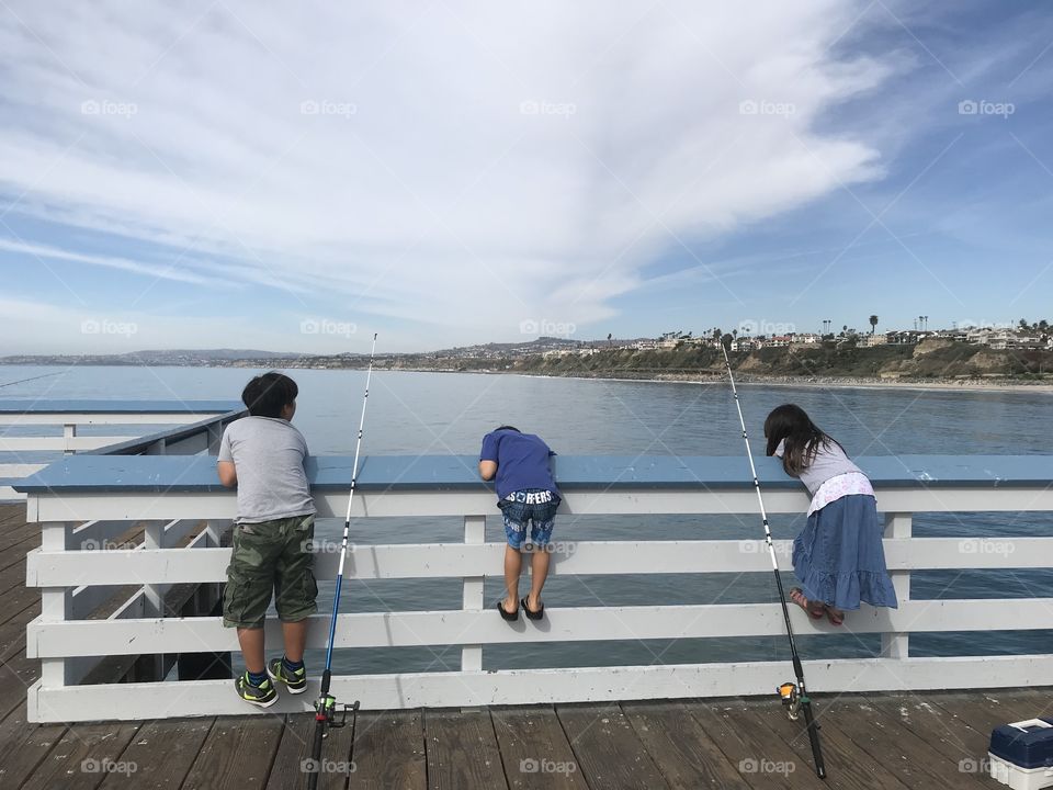 Kids fishing at pier