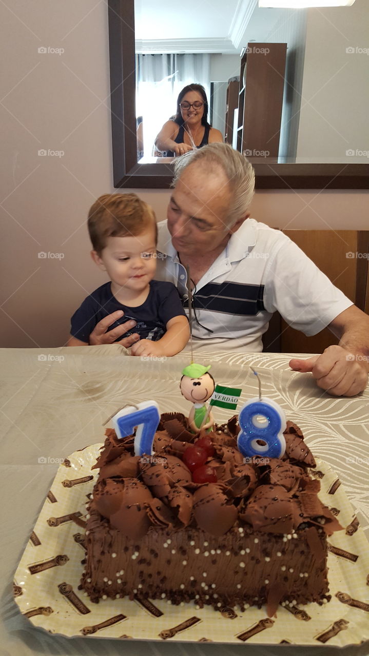 Grandfather and grandson celebrating his birthday