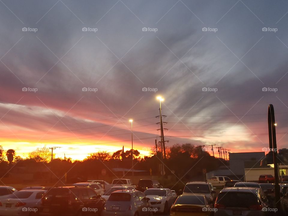 sunset while driving on to finish the holiday shopping