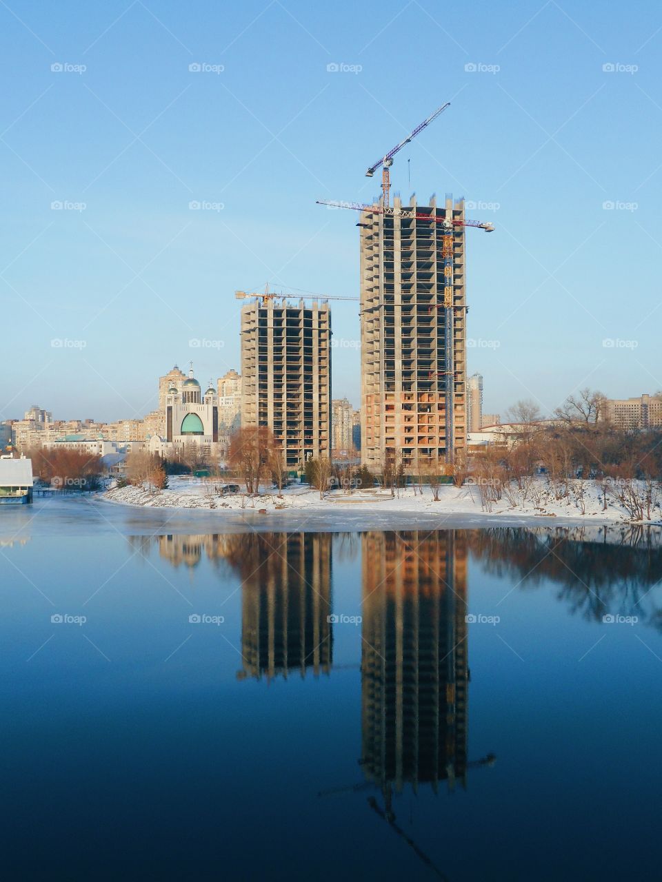 an incredible reflection of buildings in the river Dnepr