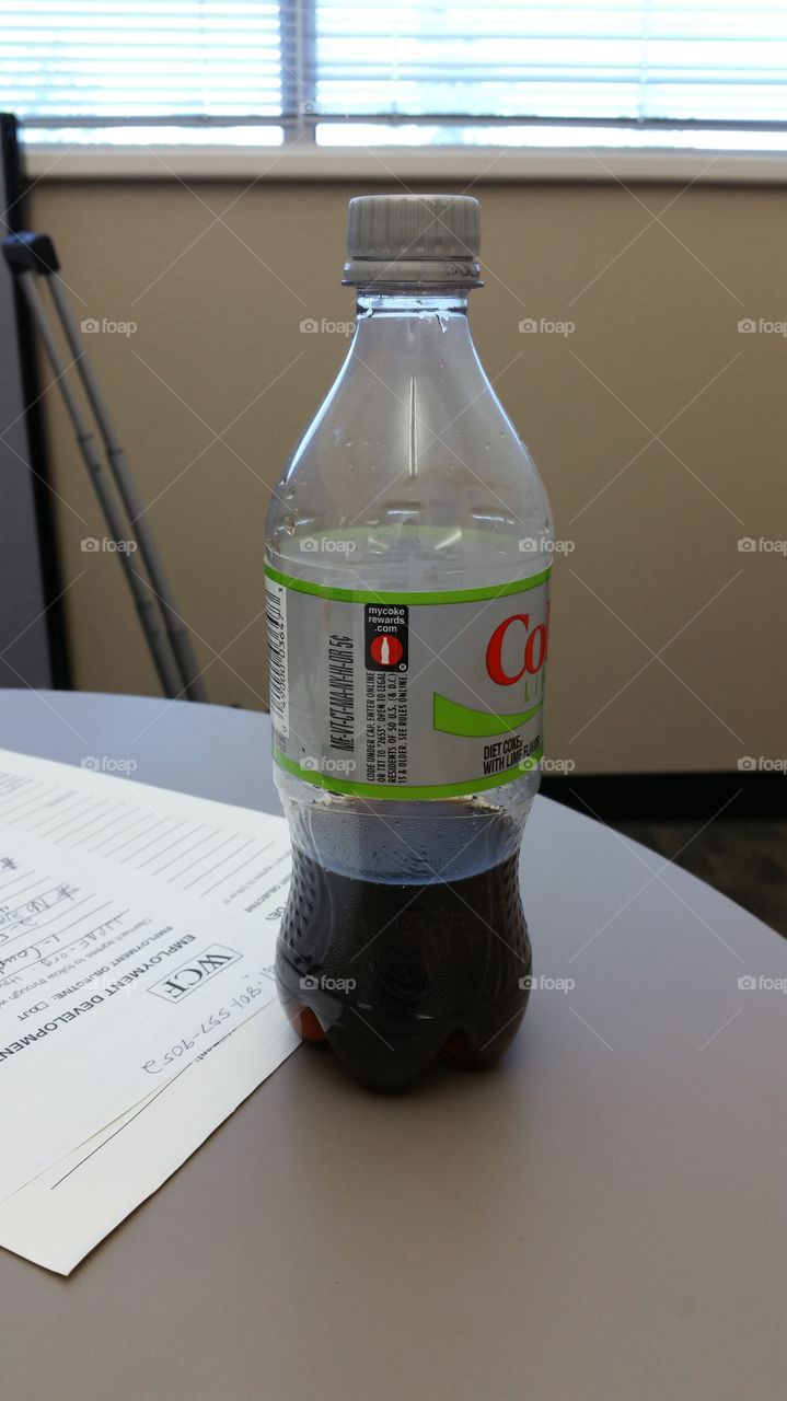 coke bottle on desk