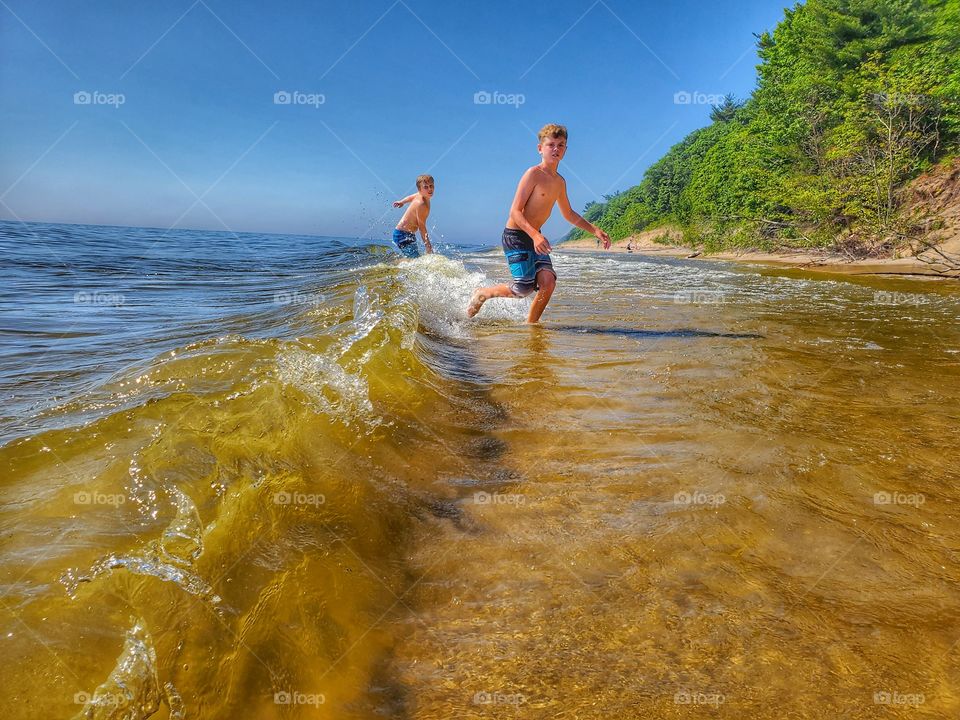 Kids playing in the waves on Lake Michigan Beach