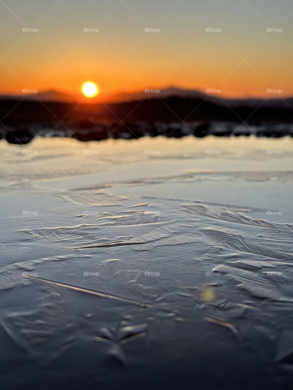 reflection of the sun in a puddle