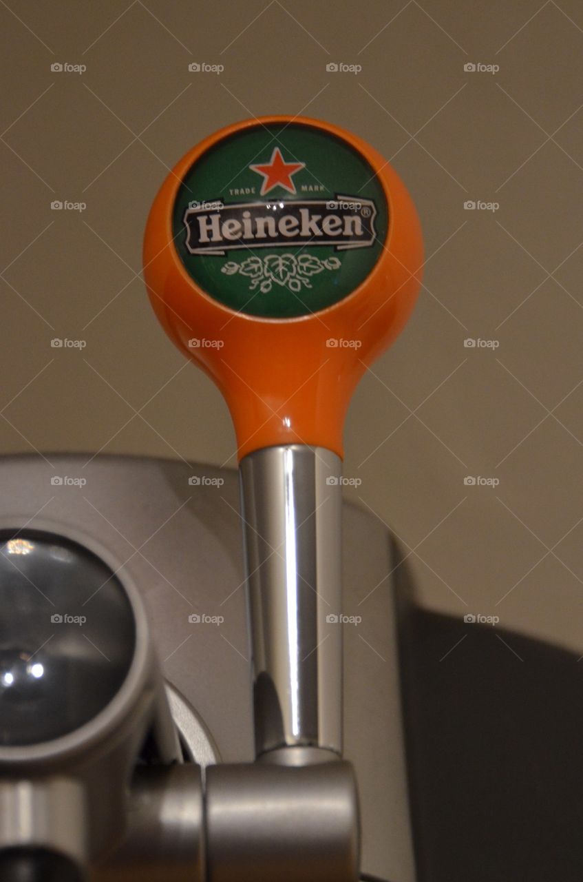 Heineken beertender tap handle.