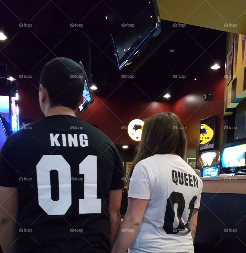 Rear view of couple standing in bar