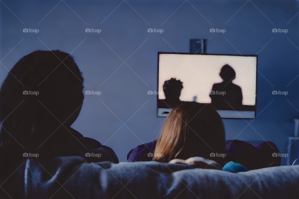 A couple watching tv