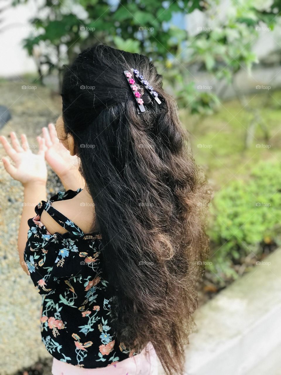 Girl with long hair with beautiful clips 