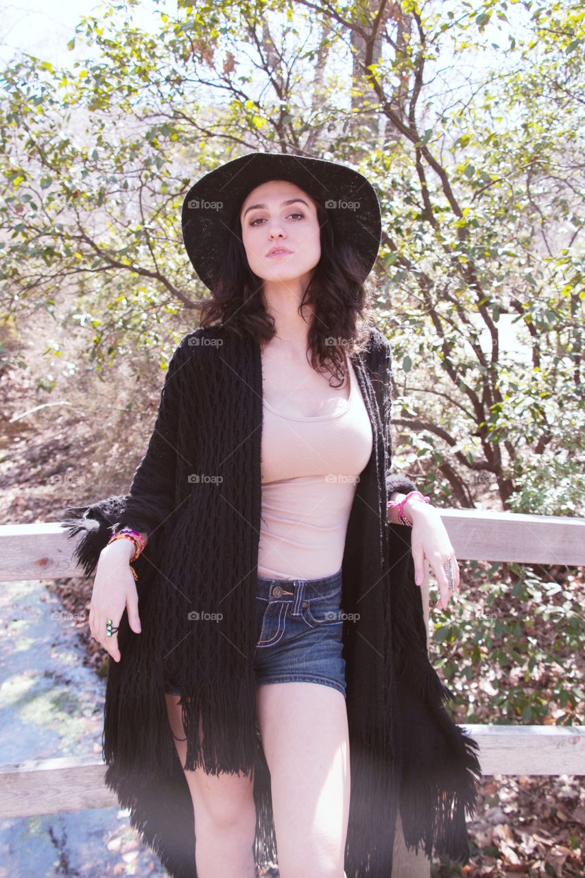 Young woman standing near railing